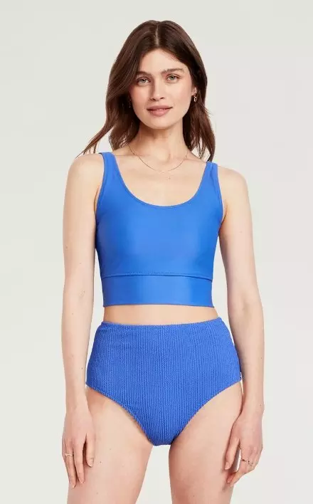 A female model dressed a Matte Longline Swim Top.