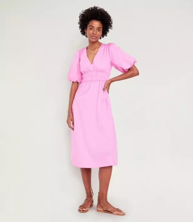 Image of a model wearing waist-defined puff-sleeve midi dress.