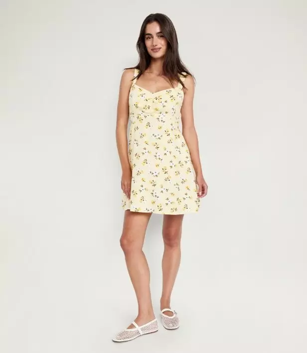 Image of a model wearing fit and flare mini dress.