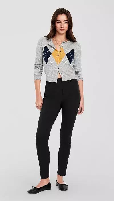 A female model wearing high waisted wow skinny pants.
