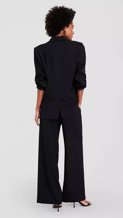 A high-waisted crinkle gauze wide leg pants and matching button down shirt.