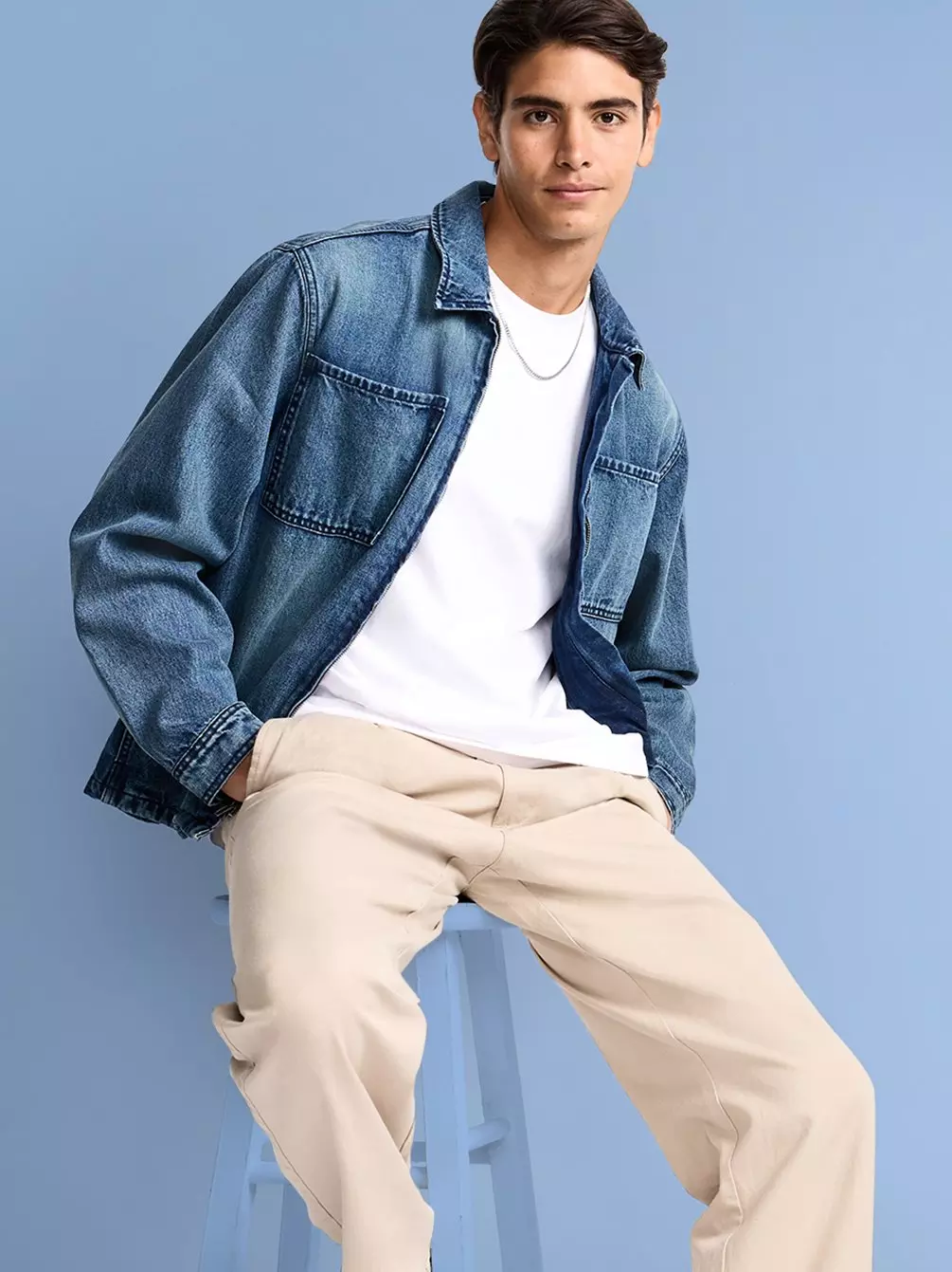 Image of a boy model wearing Old Navy pants, a white t-shirt and denim jacket. 