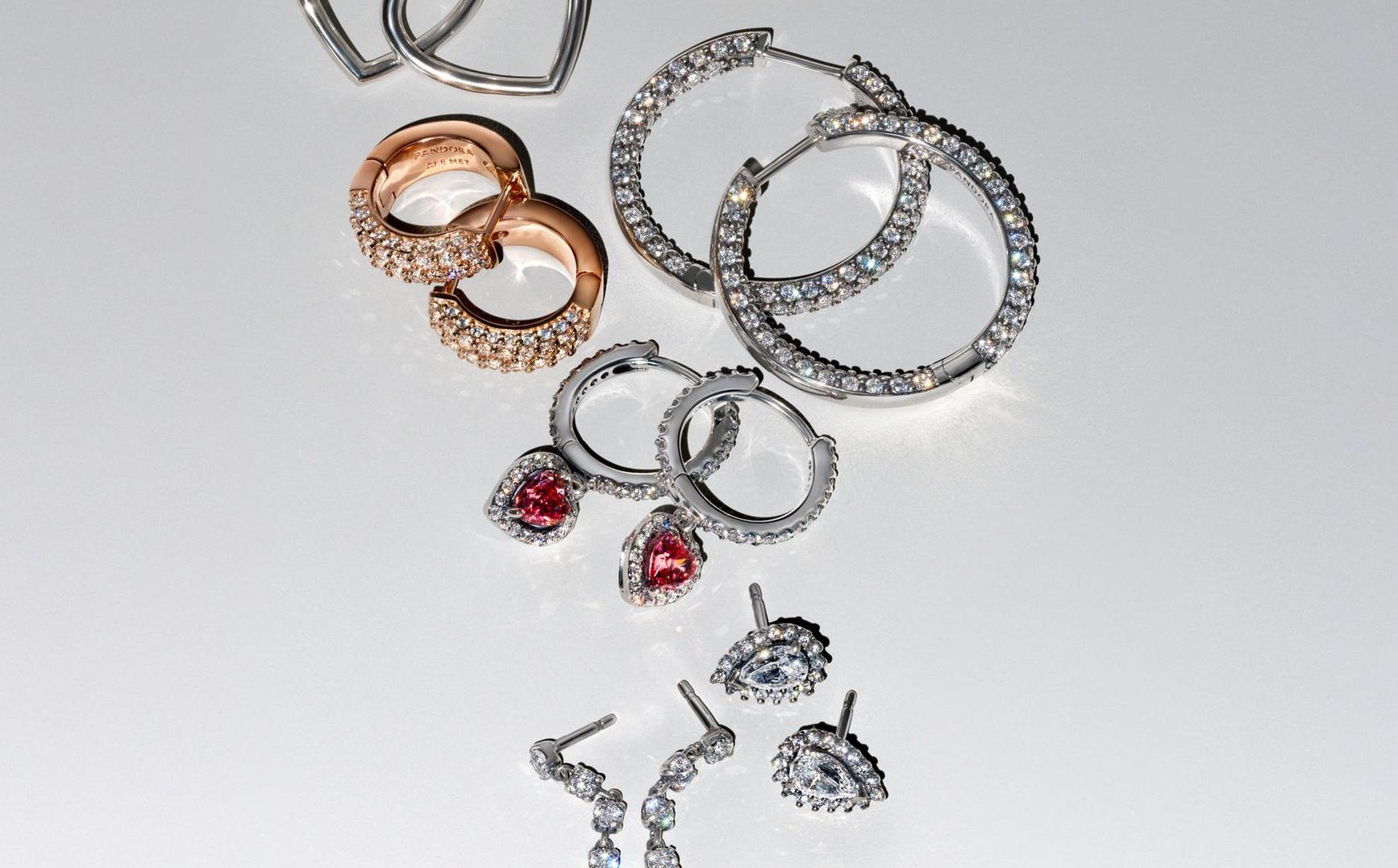 Image of silver, gold and rose gold earrings from pandora BE LOVE