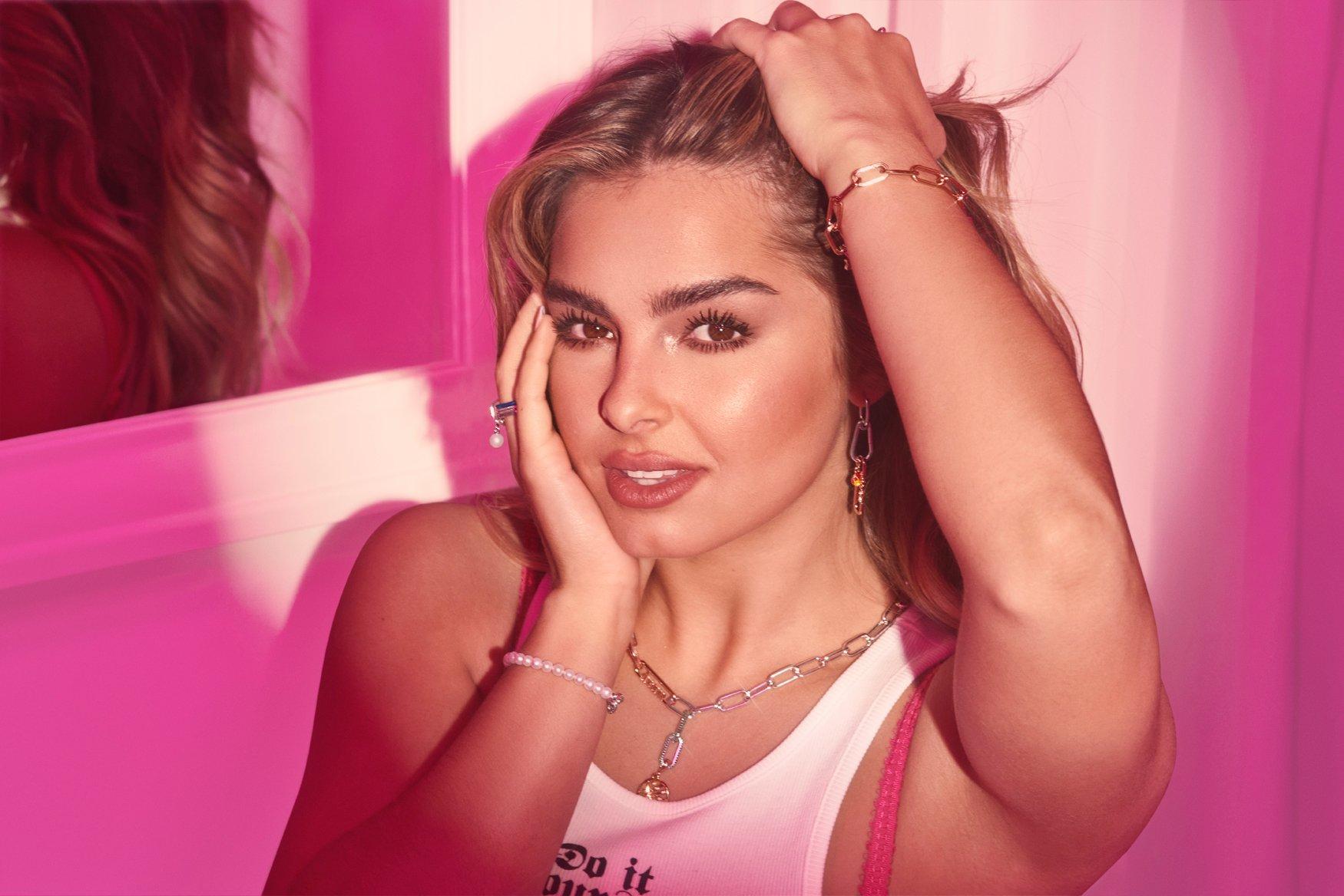 Addison Rae wearing Link Bracelet and Necklace, a pearl bracelet and ring