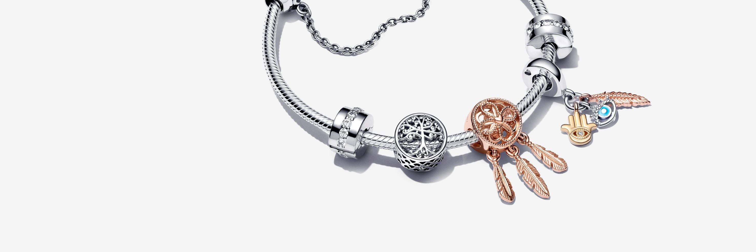 Armband aus Sterling-Silber mit Charms aus Silber und Rosé-Gold und einer silbernen Komfortkette