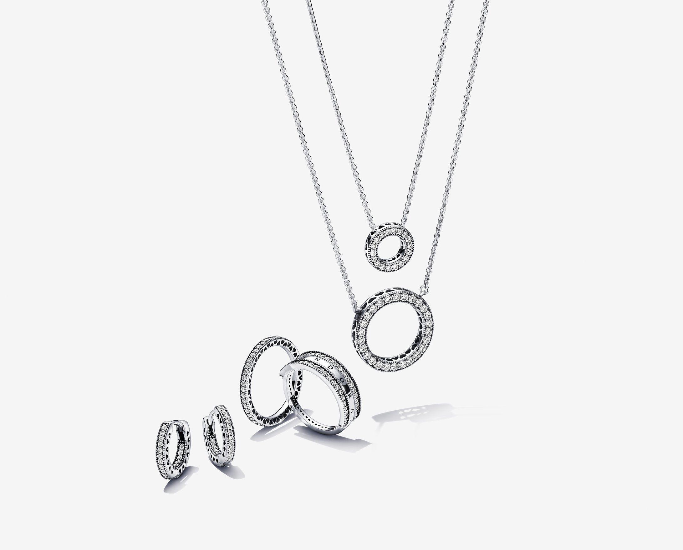 Image of silver necklaces, rings, and earrings from Pandora’s Signature range.