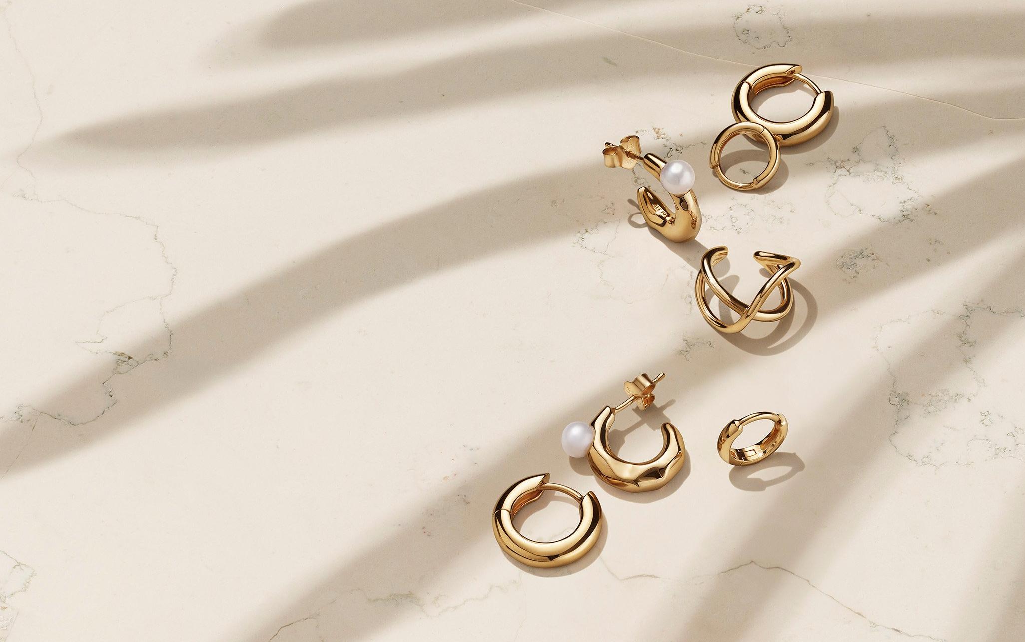 Pandora essence gold and pearls hoops earrings.