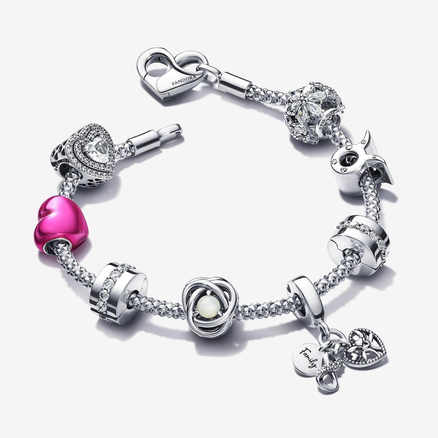 A silver bracelet and nine charms from the Just Because occasion collection