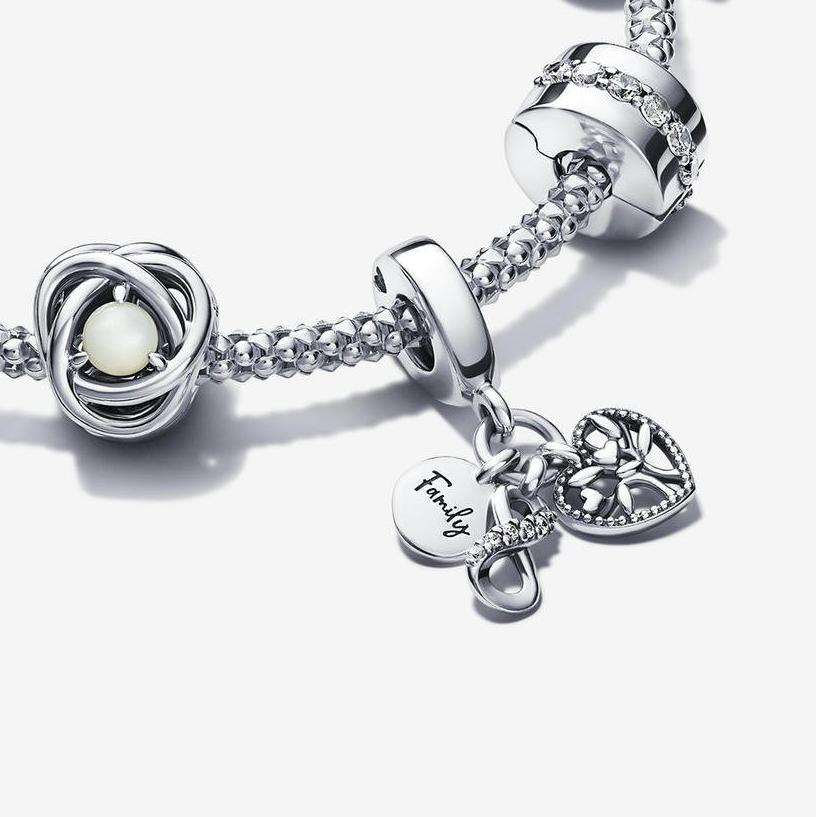 A silver bracelet and nine charms from the Just Because occasion collection