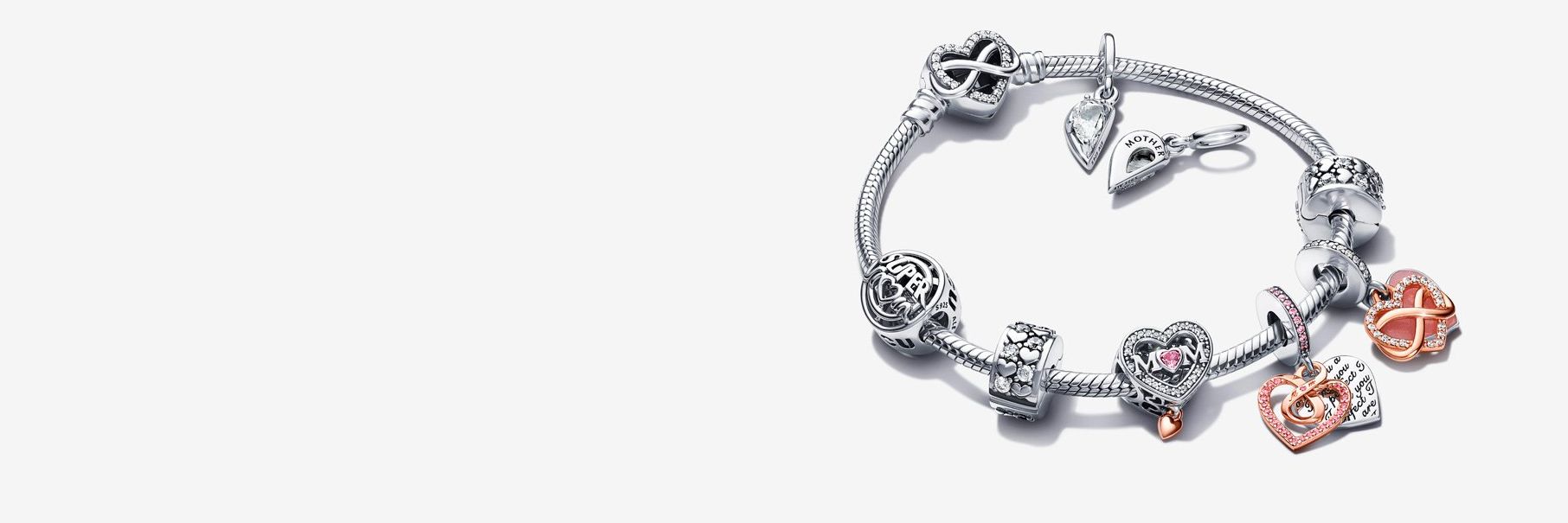 Pandora Moments Mother's Day charm bracelet with silver and rose gold charms.