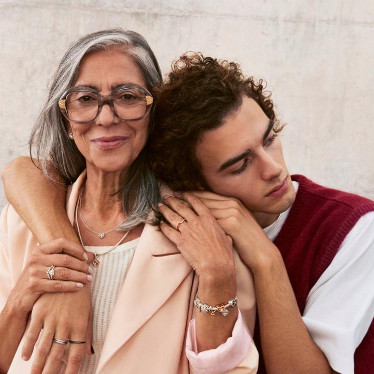 Son embraces mother who is wearing Pandora Mother's Day jewellery