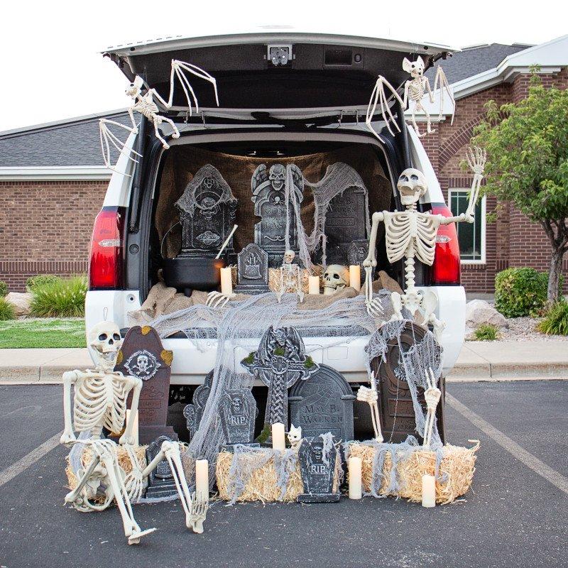 Graveyard themed Halloween trunk-or-treat decorations