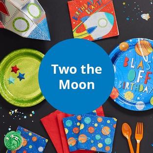 Two the Moon Theme - Assortment of Space Themed Tableware and Decor on a Table