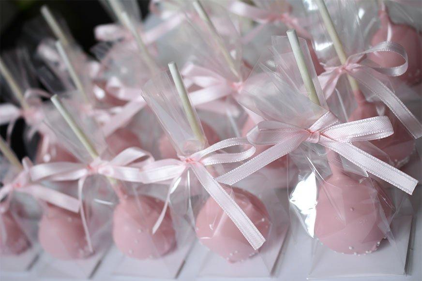 Pink cake pops sealed with pink bows