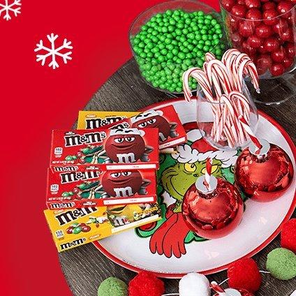 Assortment of colorful christmas chocolate and candy on a grinch theme tray