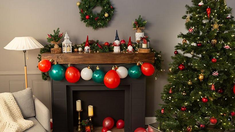 Holiday decorations on a fireplace and Christmas Tree