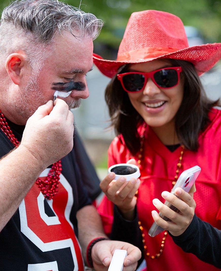Place make-up on football fan