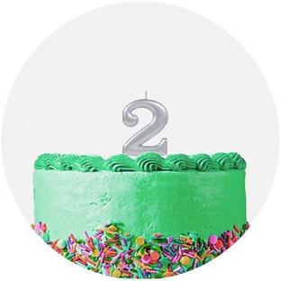 Green Frosted Single Tiered Birthday Cake with Rainbow Sprinkles and a Silver Number Two Shaped Candle