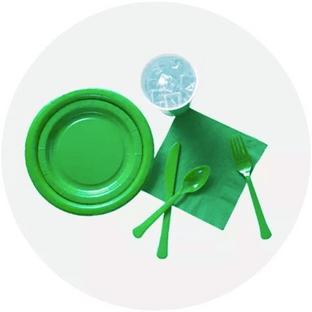 Assortment of Kelly Green Tableware Including Disposable Plates, Sliverware, Napkins, and a Cup