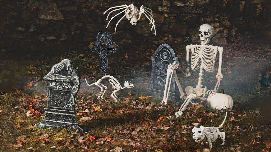 Spooky graveyard with skeletons and tombstones