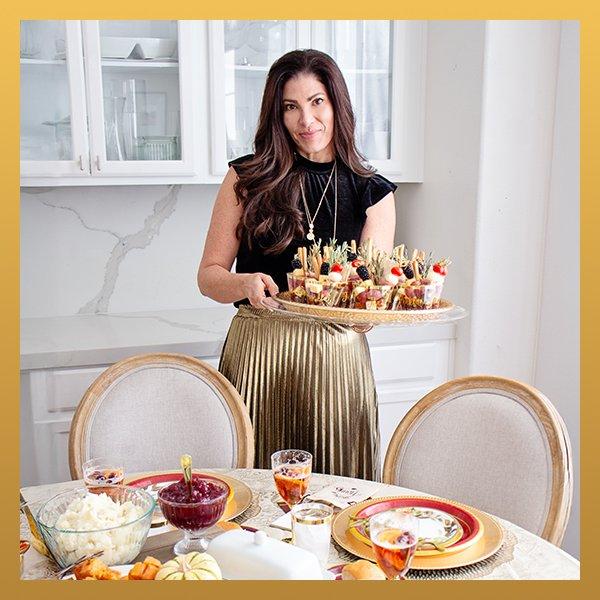 Woman holding a tray of Thanksgiving food