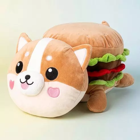 Jucărie de pluș în formă de corgi cu corp de hamburger cu salată, roșii și chifle.