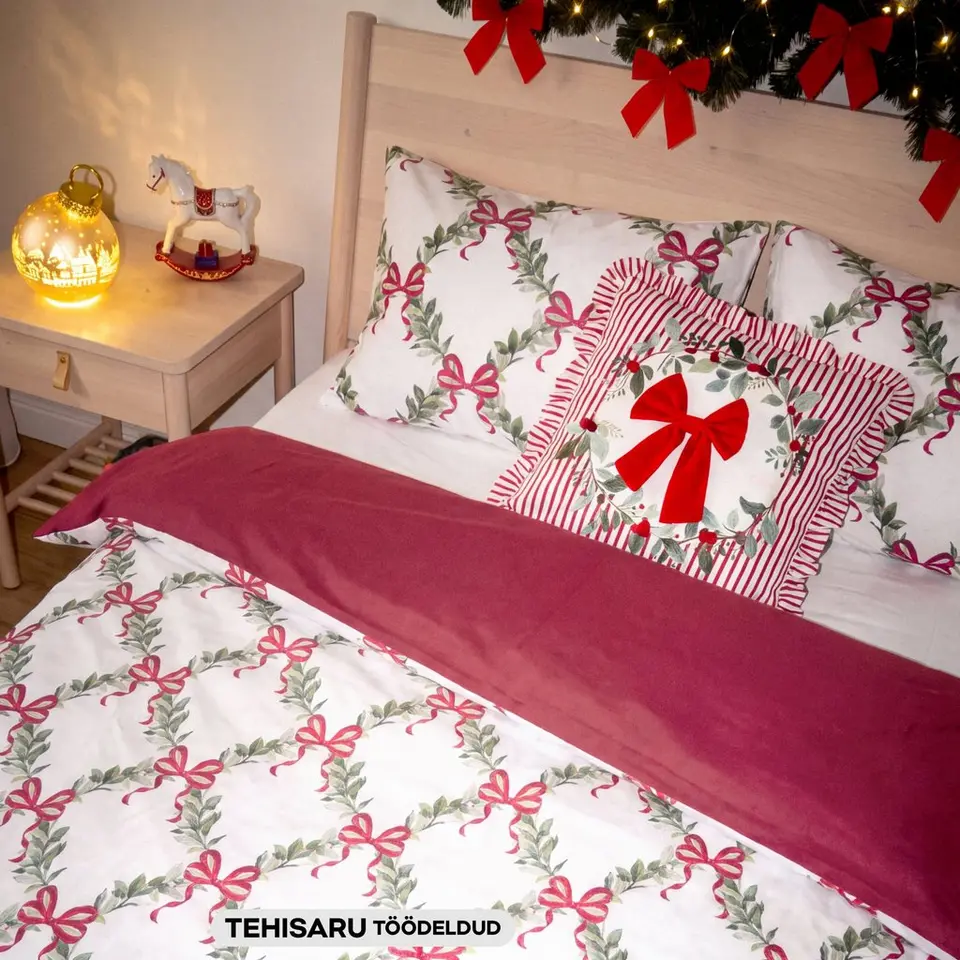 Pepco festive bedding set with wreath and bow print, and matching cushion with red bow.