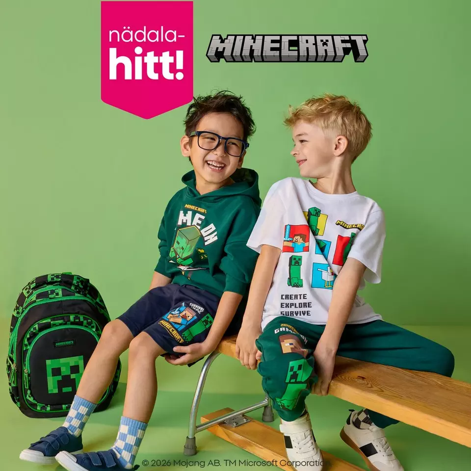 Two boys wearing Pepco Minecraft clothing sitting together and smiling, with a Minecraft backpack beside them.