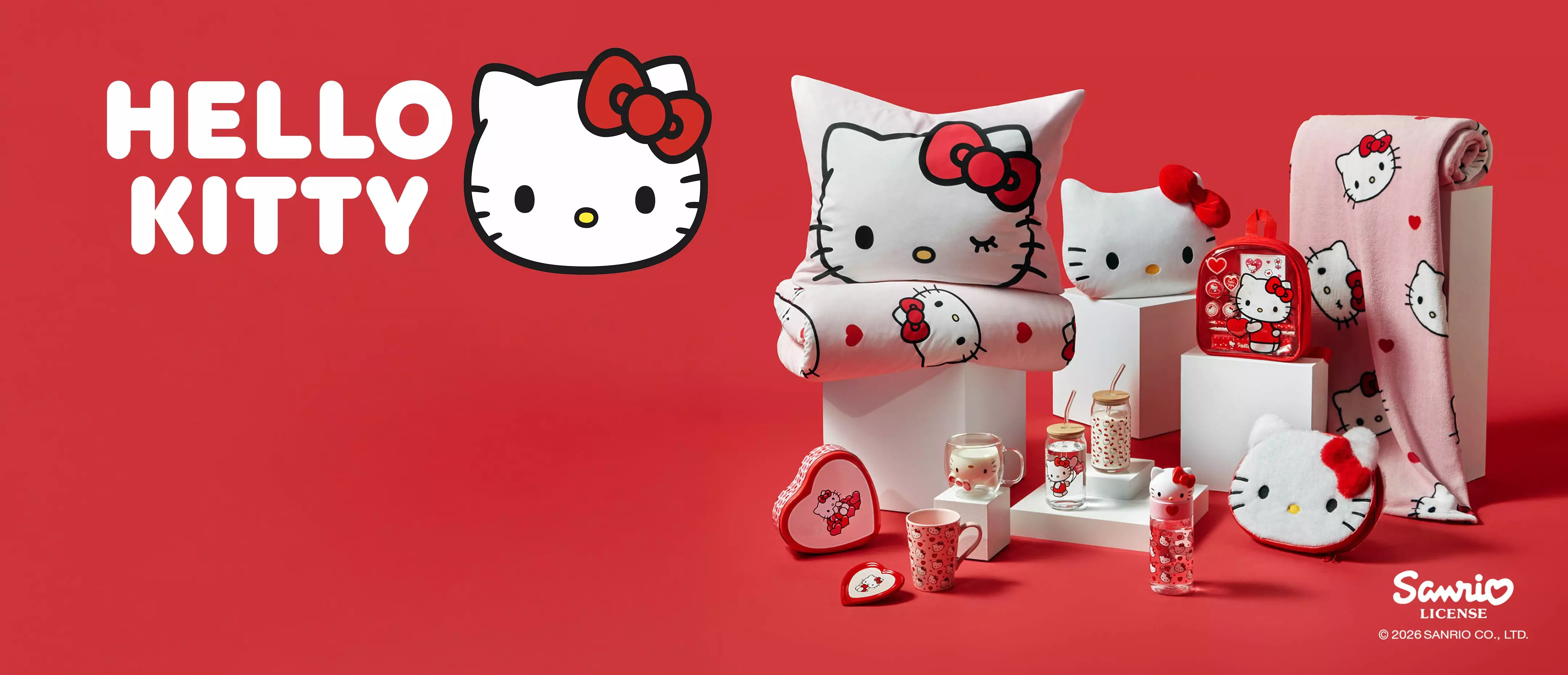 Kolekcja Hello Kitty w Pepco - poduszki, koce, kubki i akcesoria z popularnym motywem na czerwonym tle.