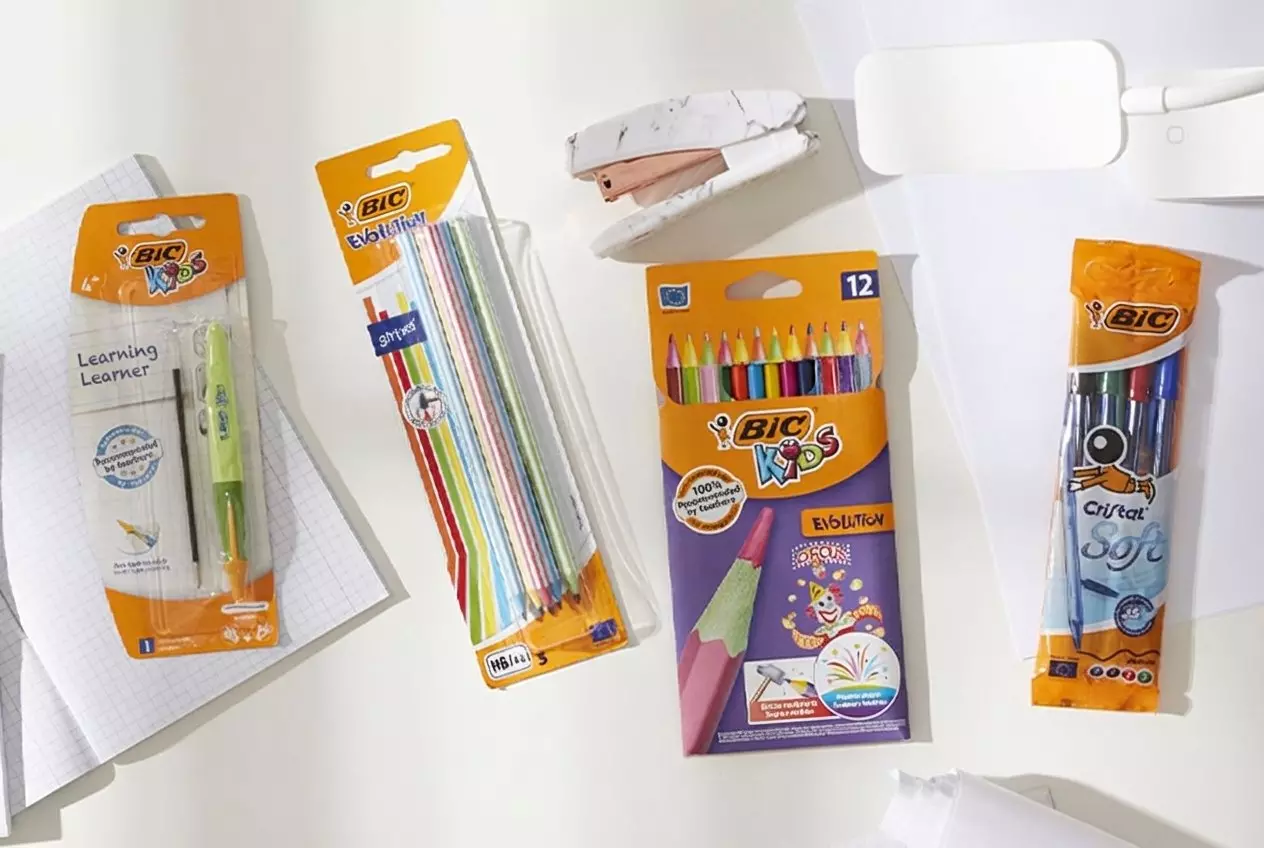 Pepco selection of BIC stationery including kids colored pencils, learning pencil, and ballpoint pens arranged on white surface.