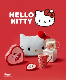 Pepco Hello Kitty collection featuring pillow, glass mug, ceramic mug, and heart-shaped containers against red background.