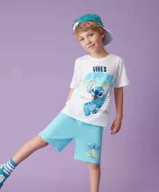 Boy wearing white Stitch t-shirt with "SUMMER VIBES" text and matching turquoise shorts with bucket hat.