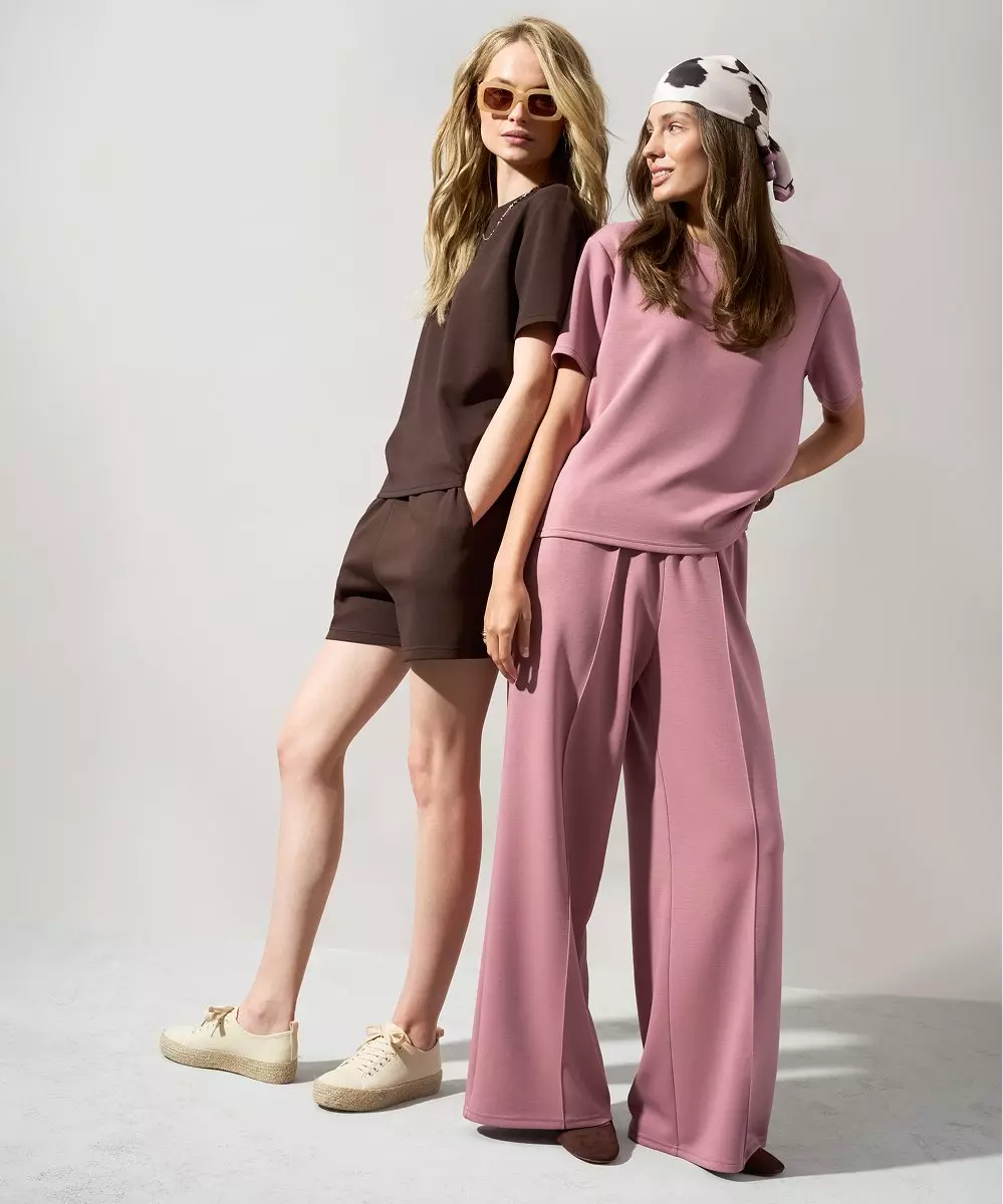 Pepco women's loungewear featuring brown co-ord set with shorts and pink co-ord set with wide-leg trousers.