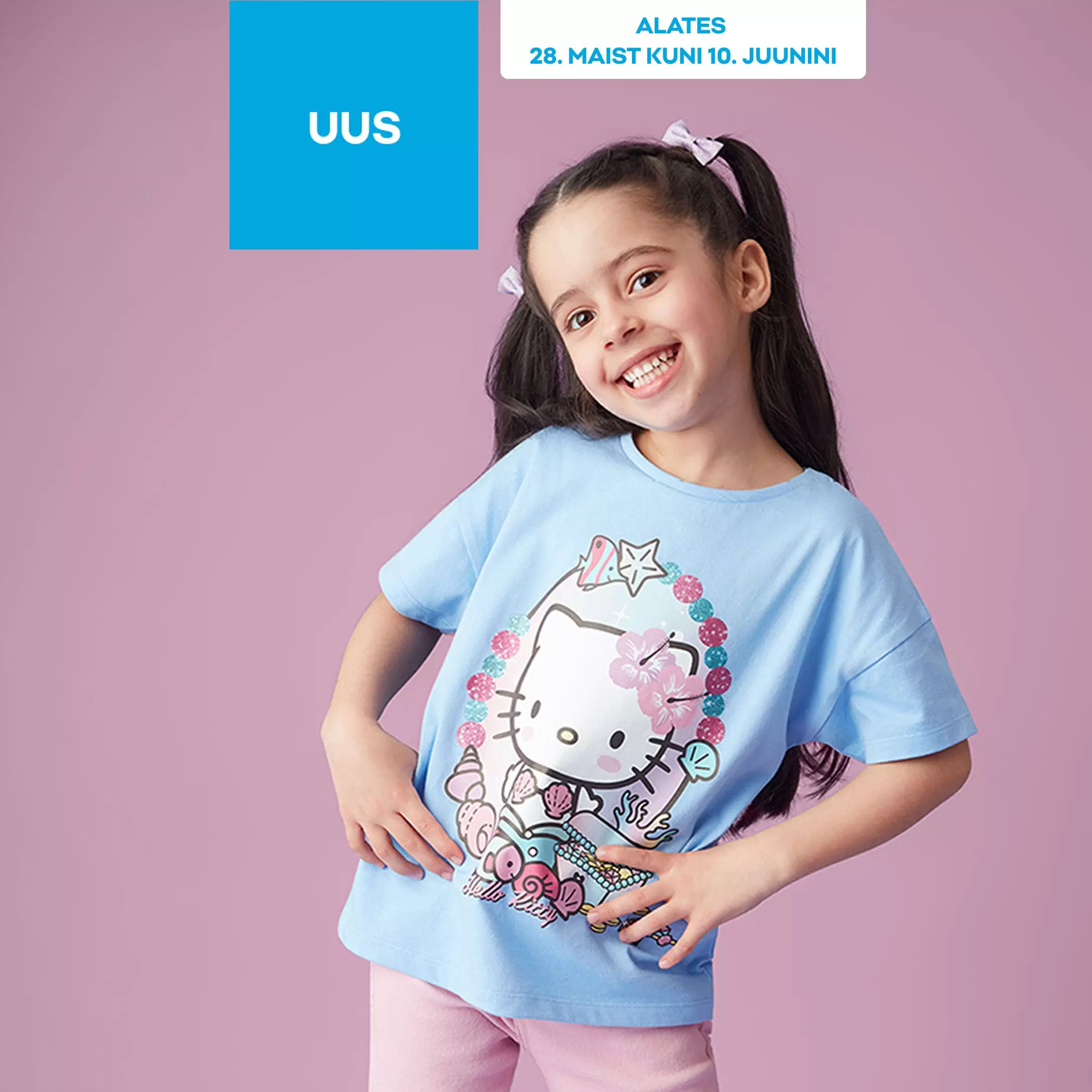 Smiling girl wearing Pepco light blue t-shirt with Hello Kitty character design and hair bows.