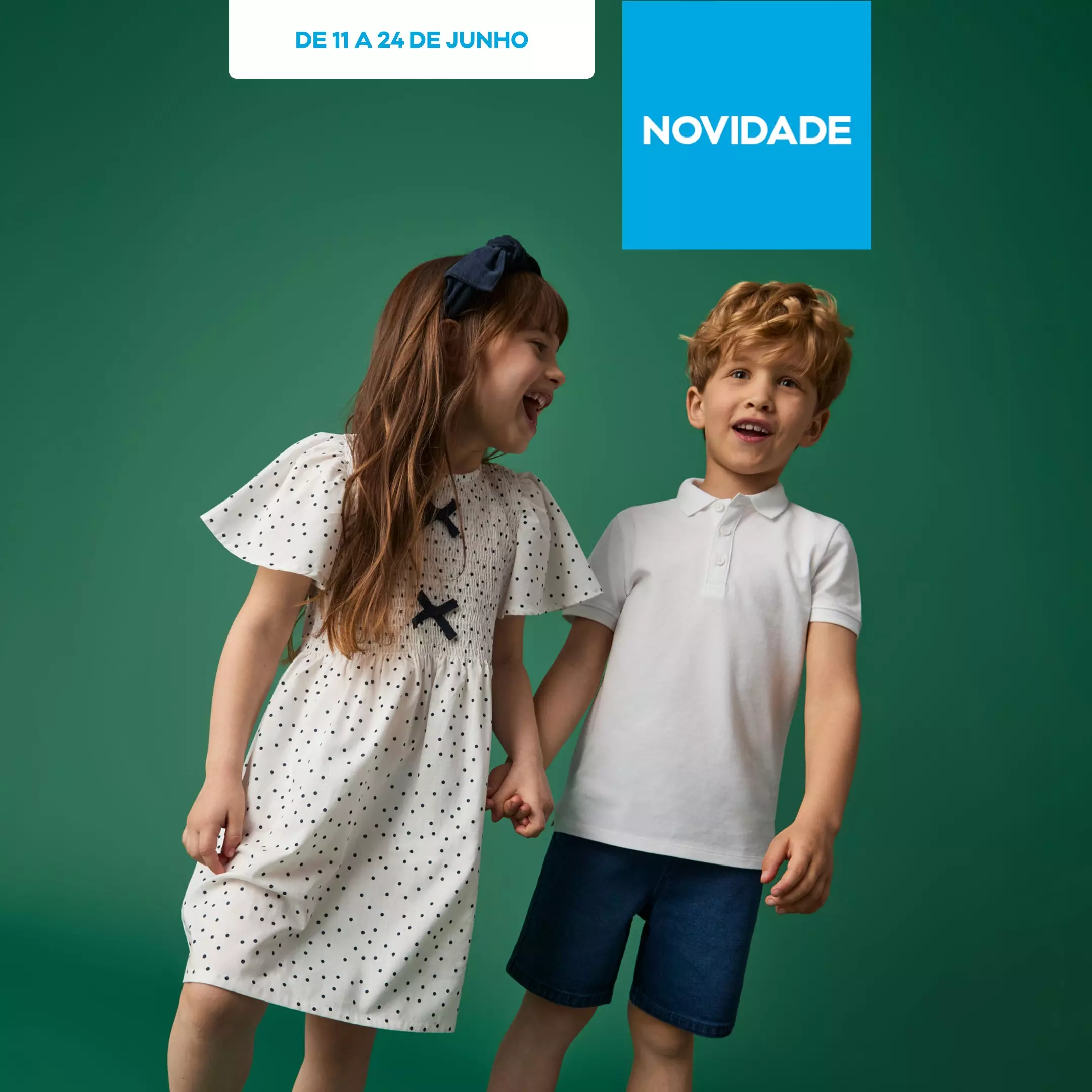 Crianças sorridentes a usar roupa Pepco, menina com vestido às bolinhas e menino com polo branco.