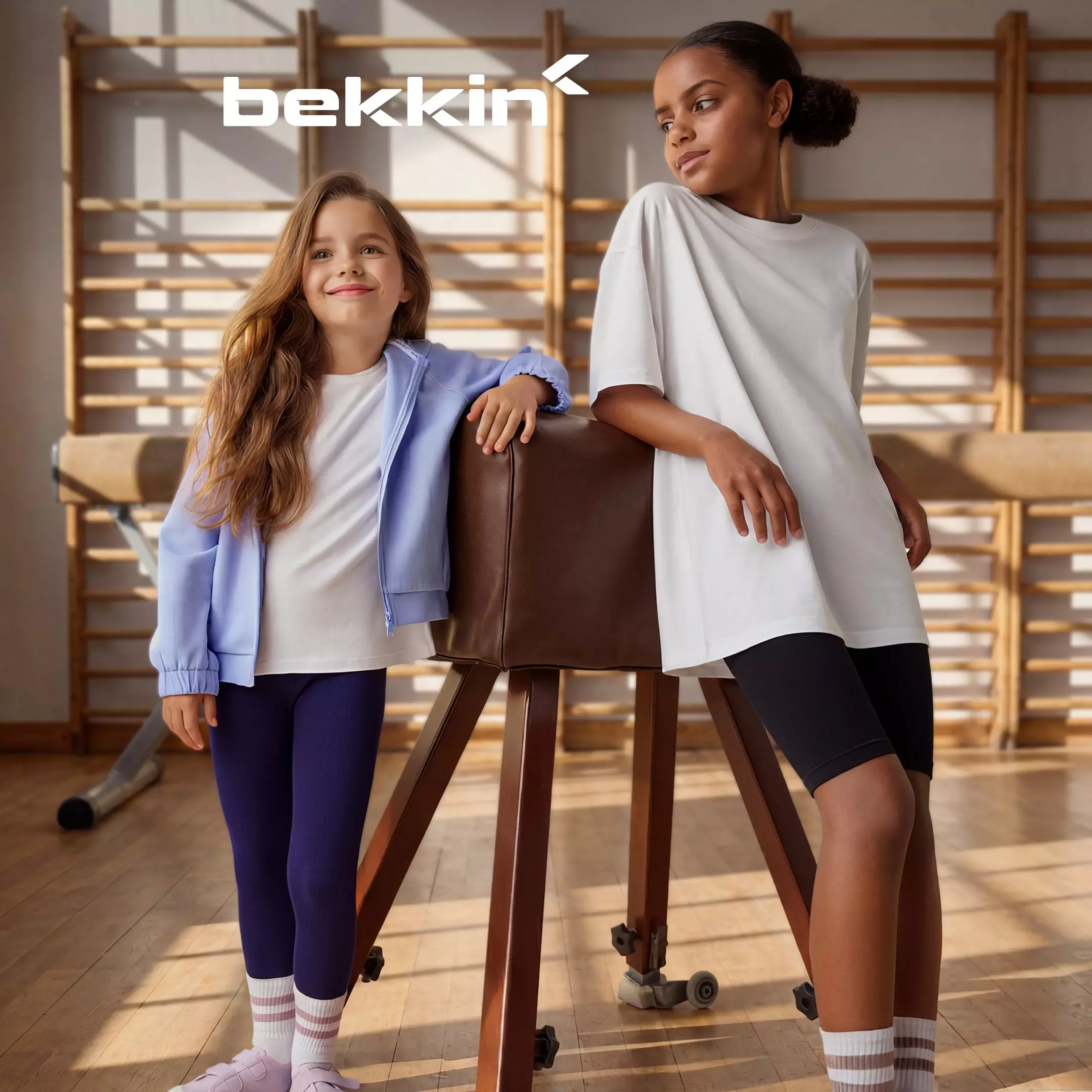 Pepco girls posing in bekkin branded activewear in a gym setting.