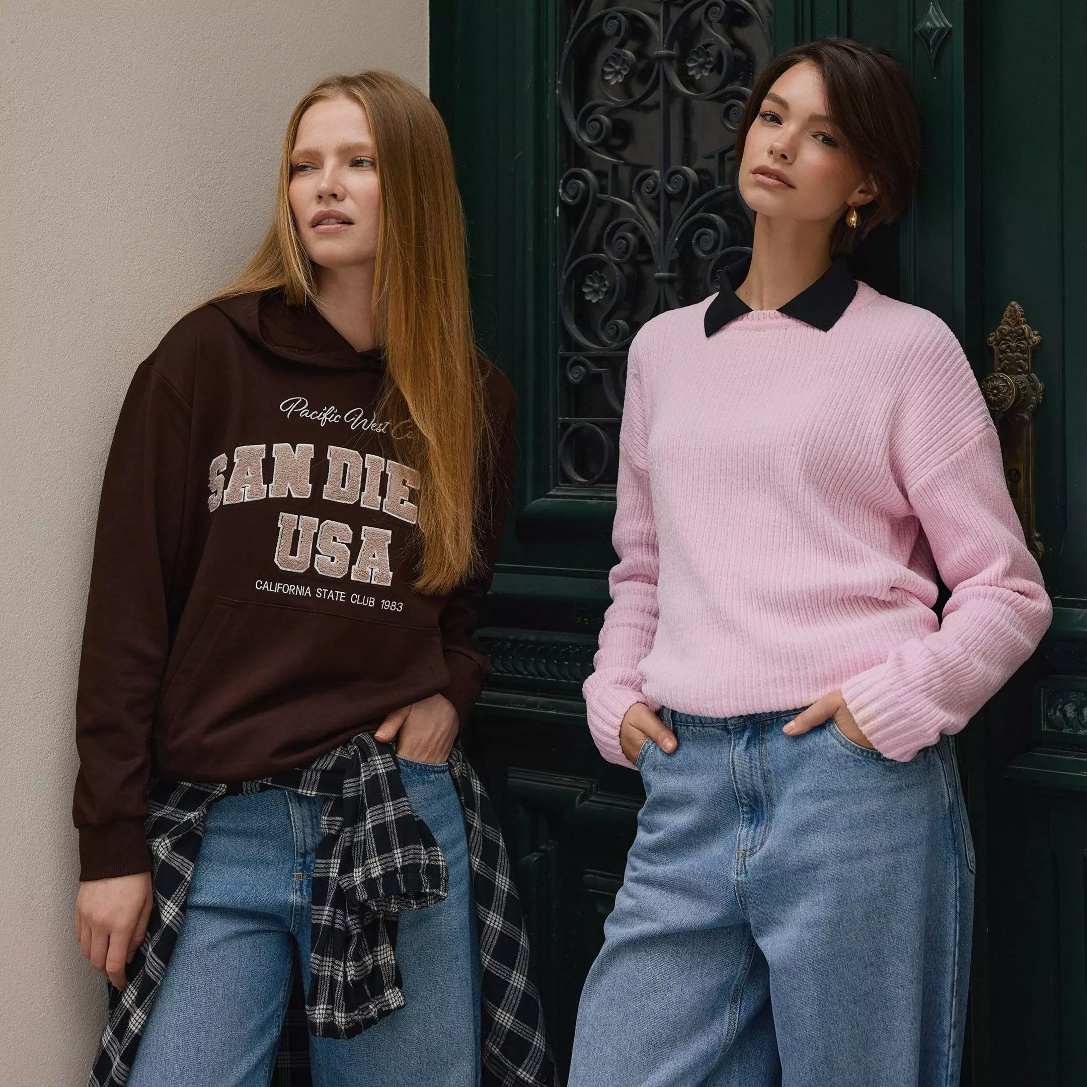 Two women modelling Pepco clothing: one in a brown San Diego hoodie, the other in a pink jumper with black collar.
