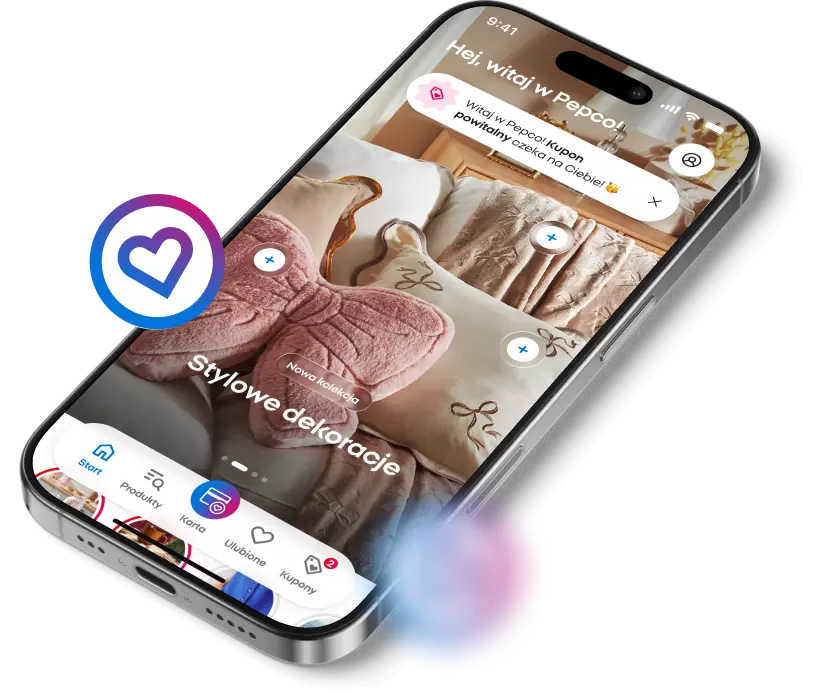 Smartfon wyświetlający aplikację zakupową z dekoracjami domowymi i ikoną serca po lewej stronie.