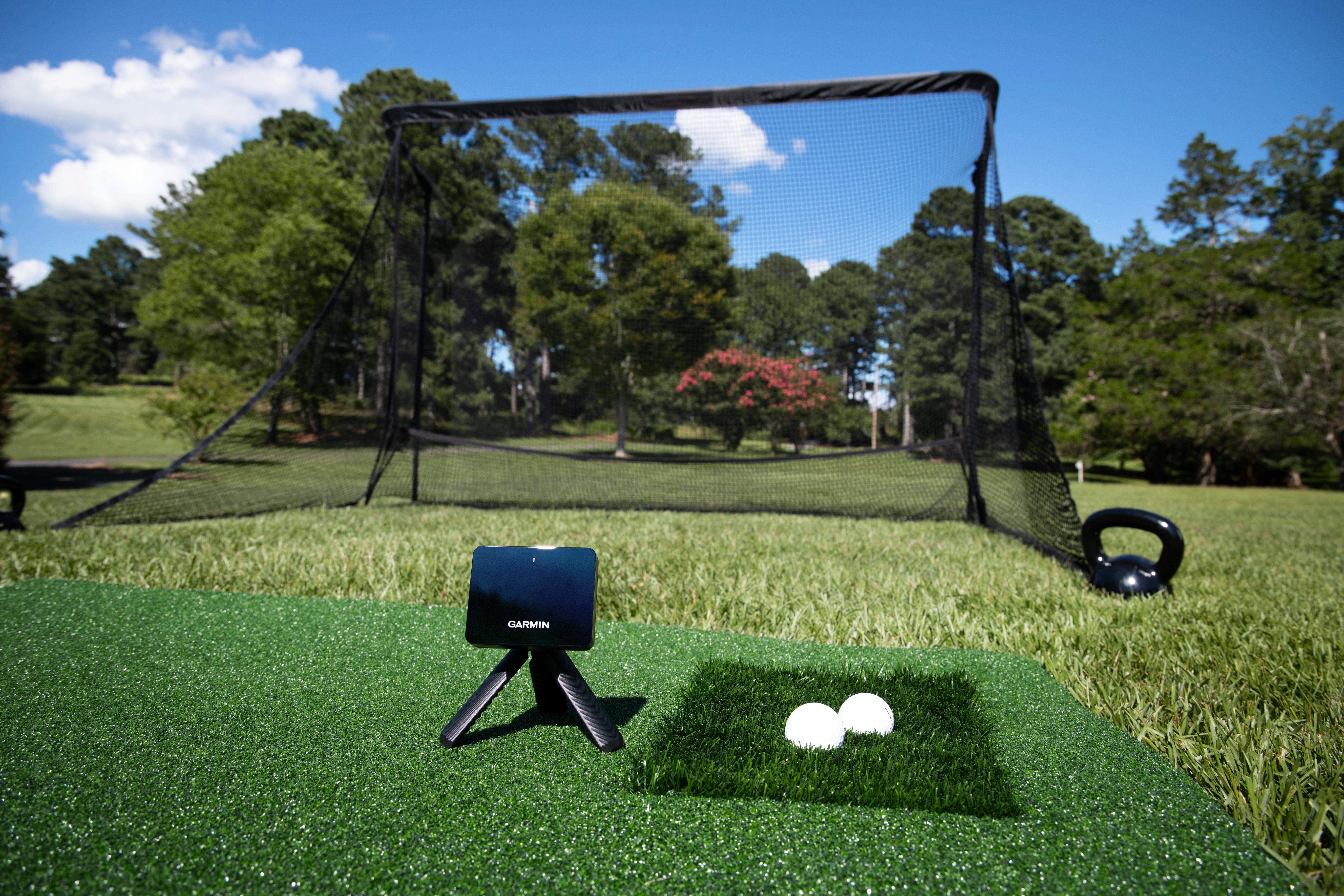Player playing in his backyard with the launch monitor