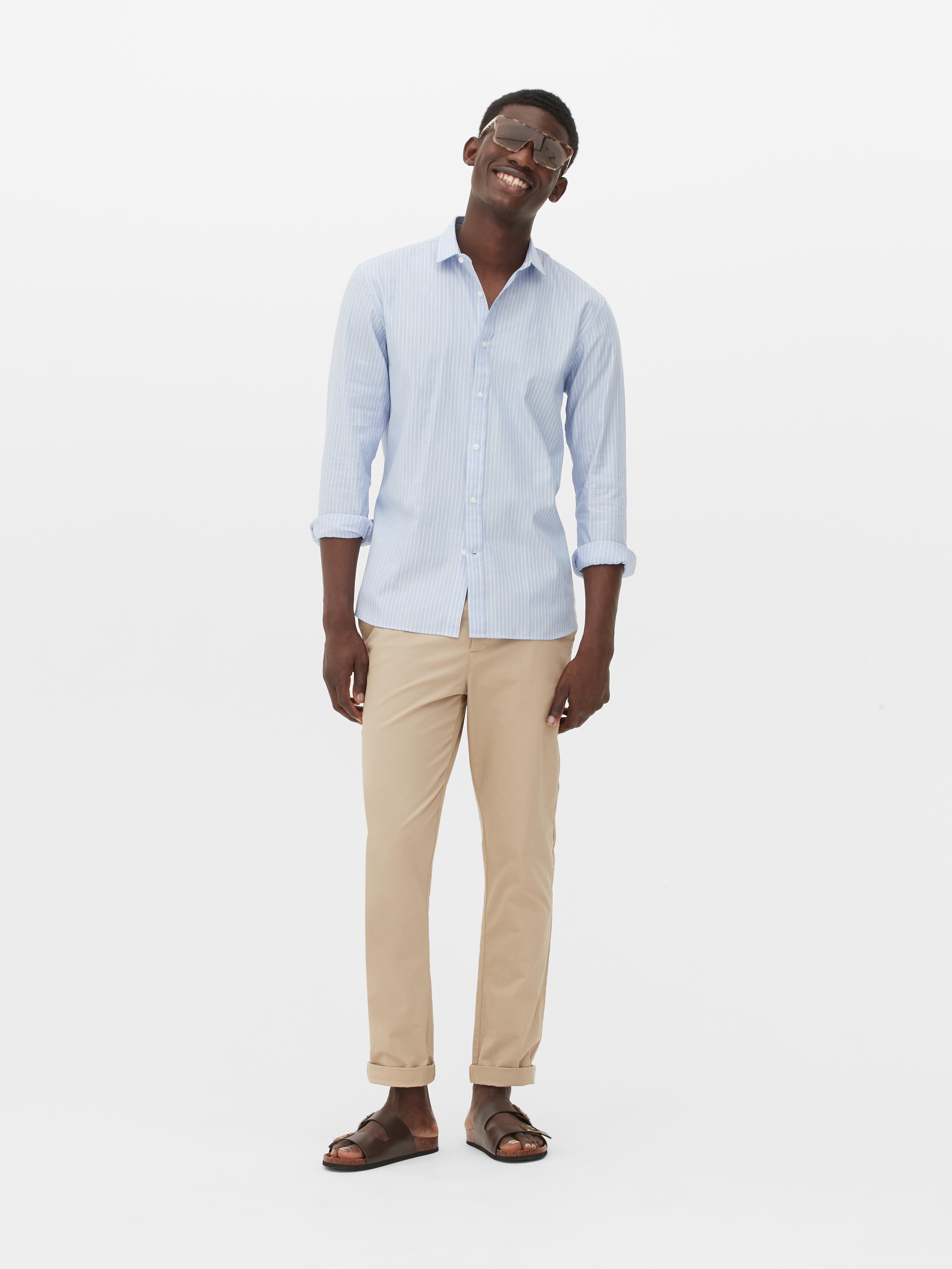 light blue dress shirt with black pants