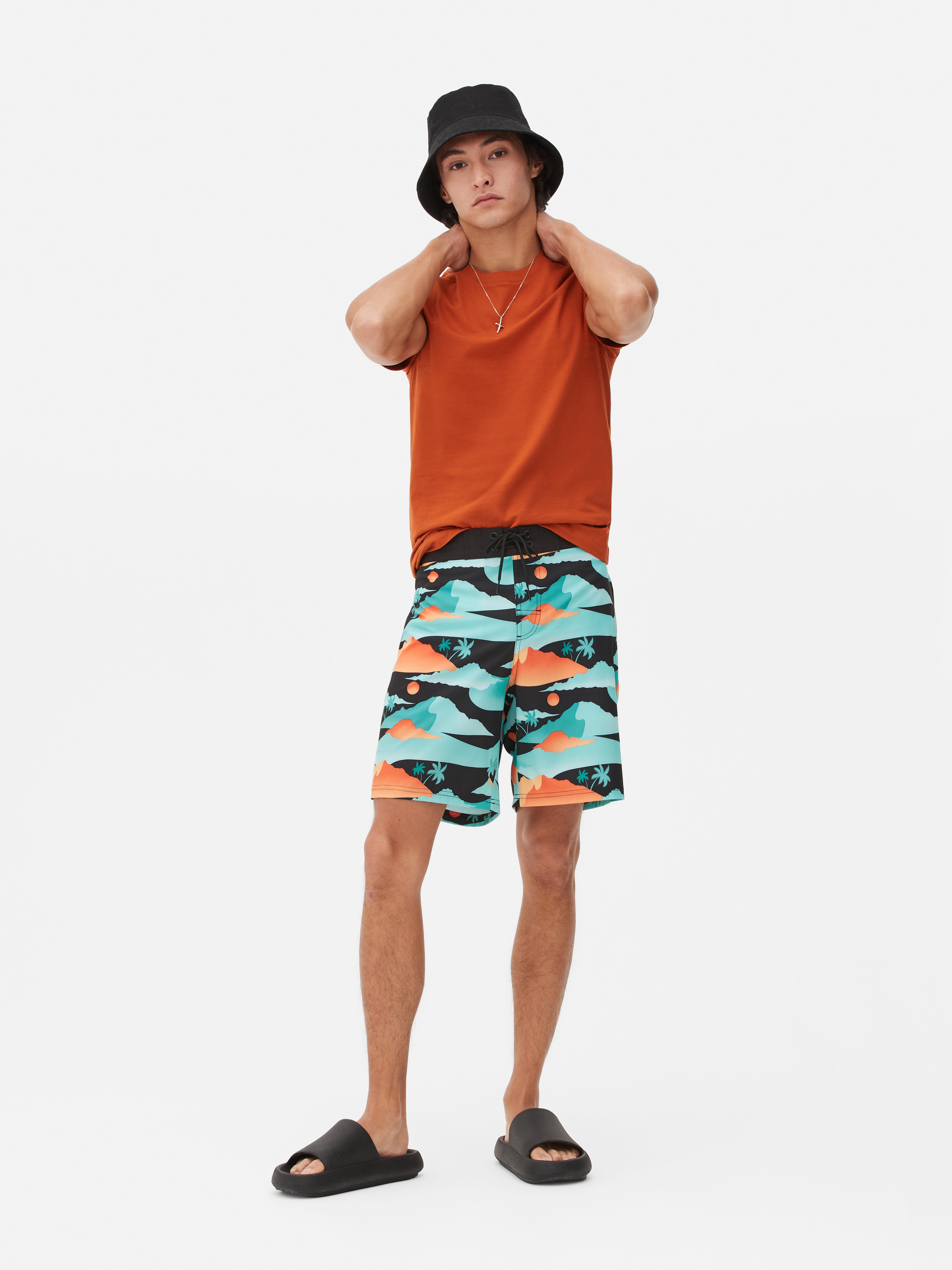 Boardshorts mit Palmen-Print Türkis