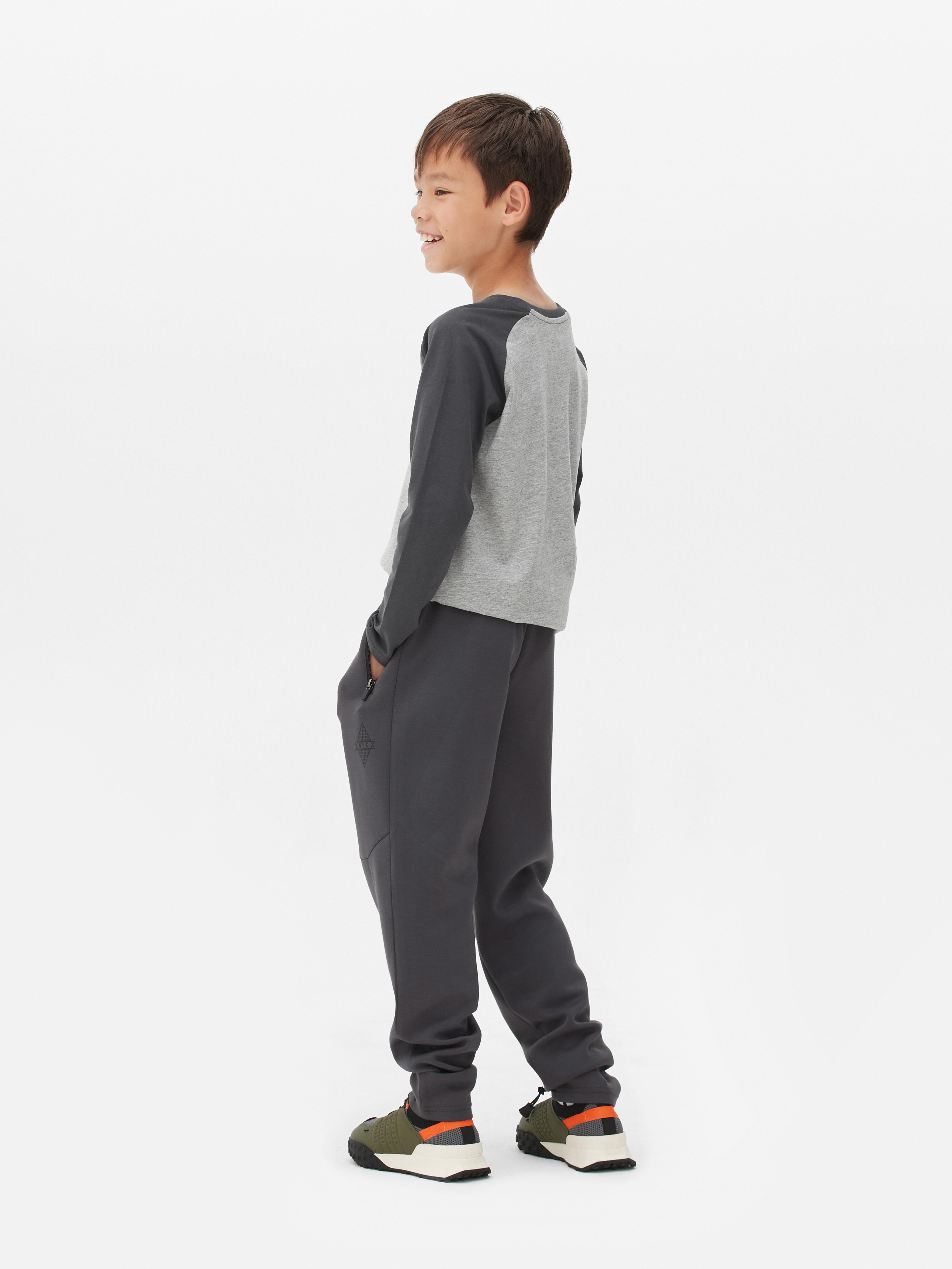 Pantaloni da tuta con tasca e zip