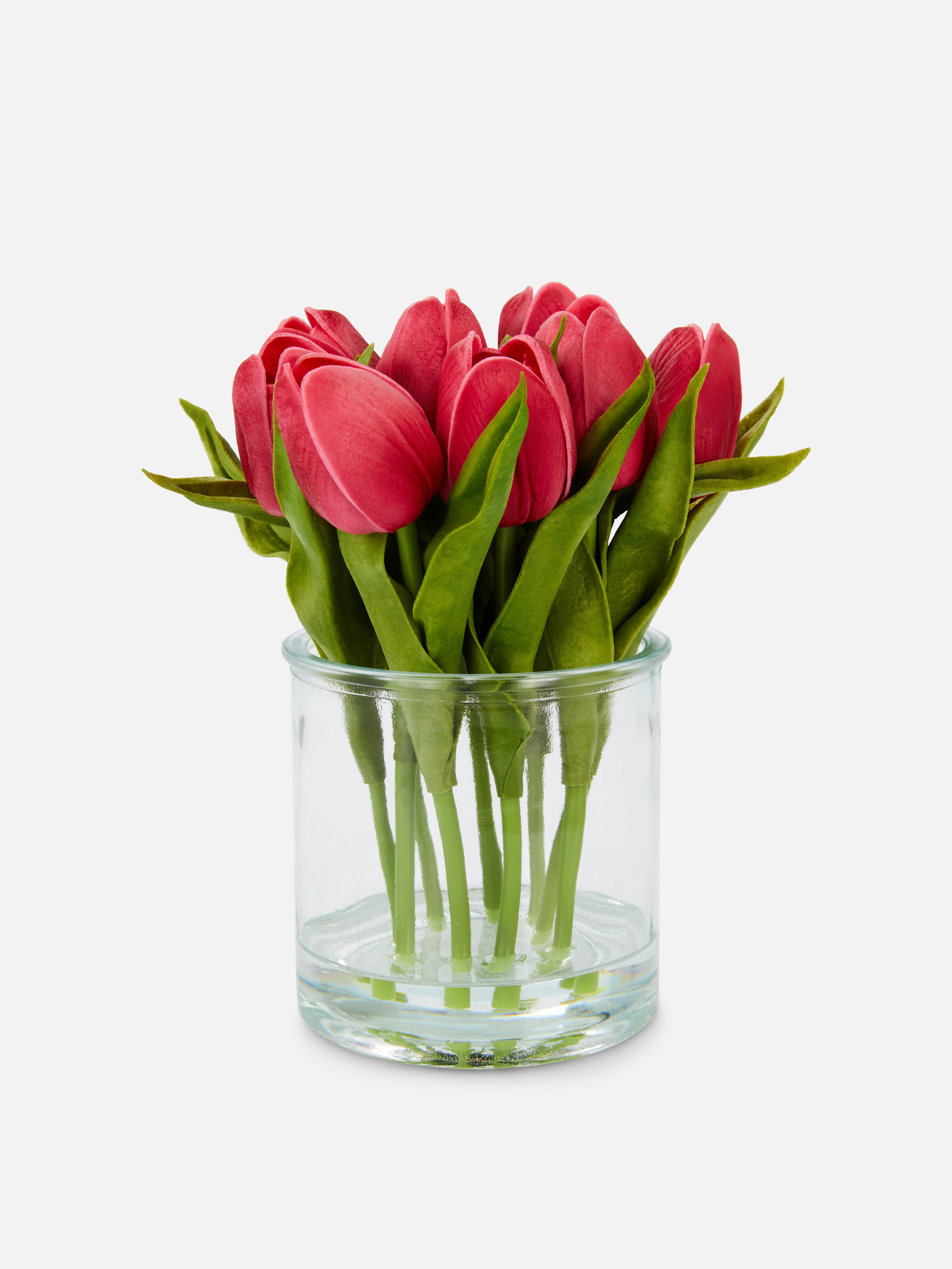 Tulipes artificielles dans vase en verre