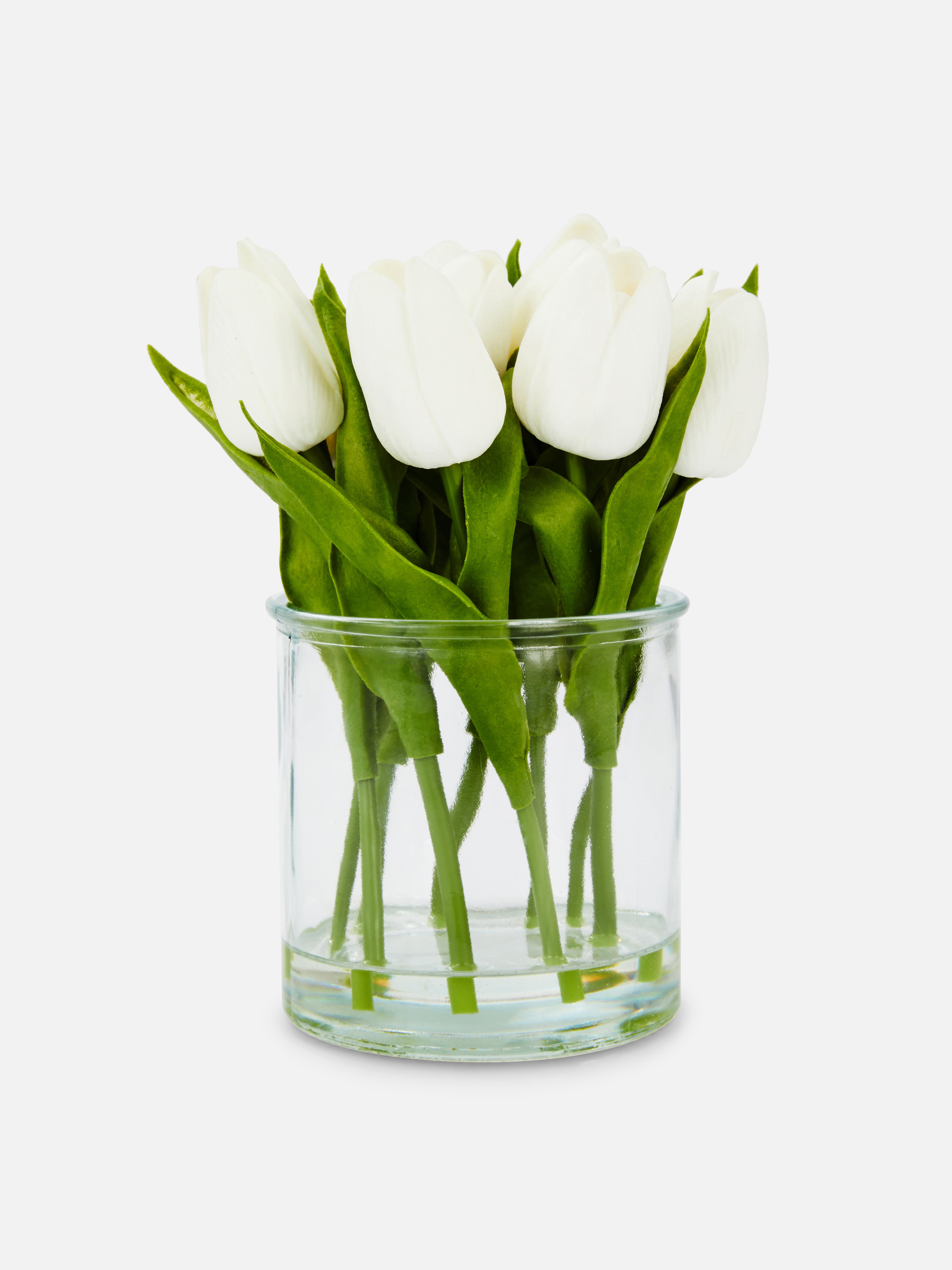 Tulipes artificielles dans vase en verre