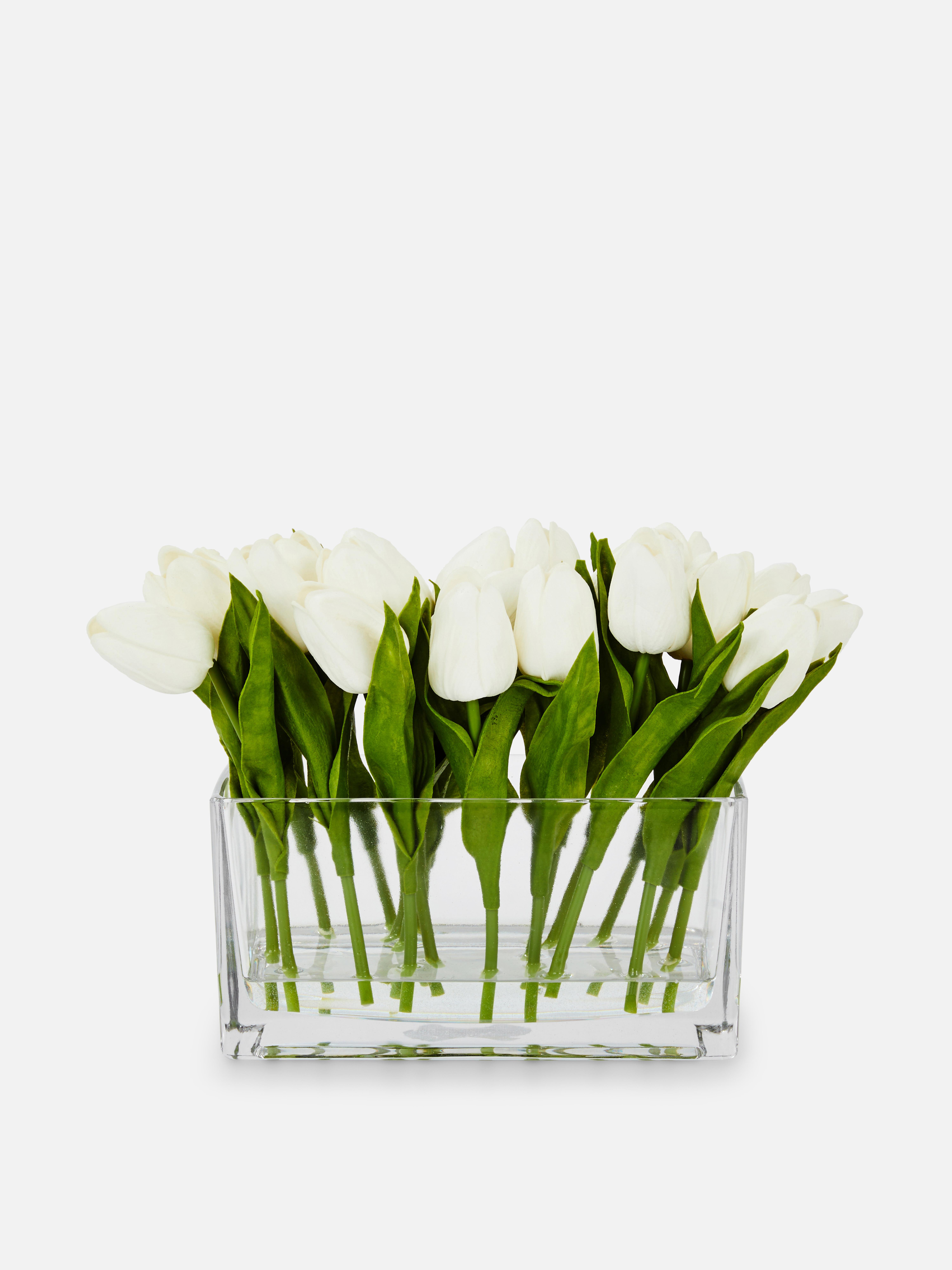 Tulipes artificielles dans vase en verre rectangulaire