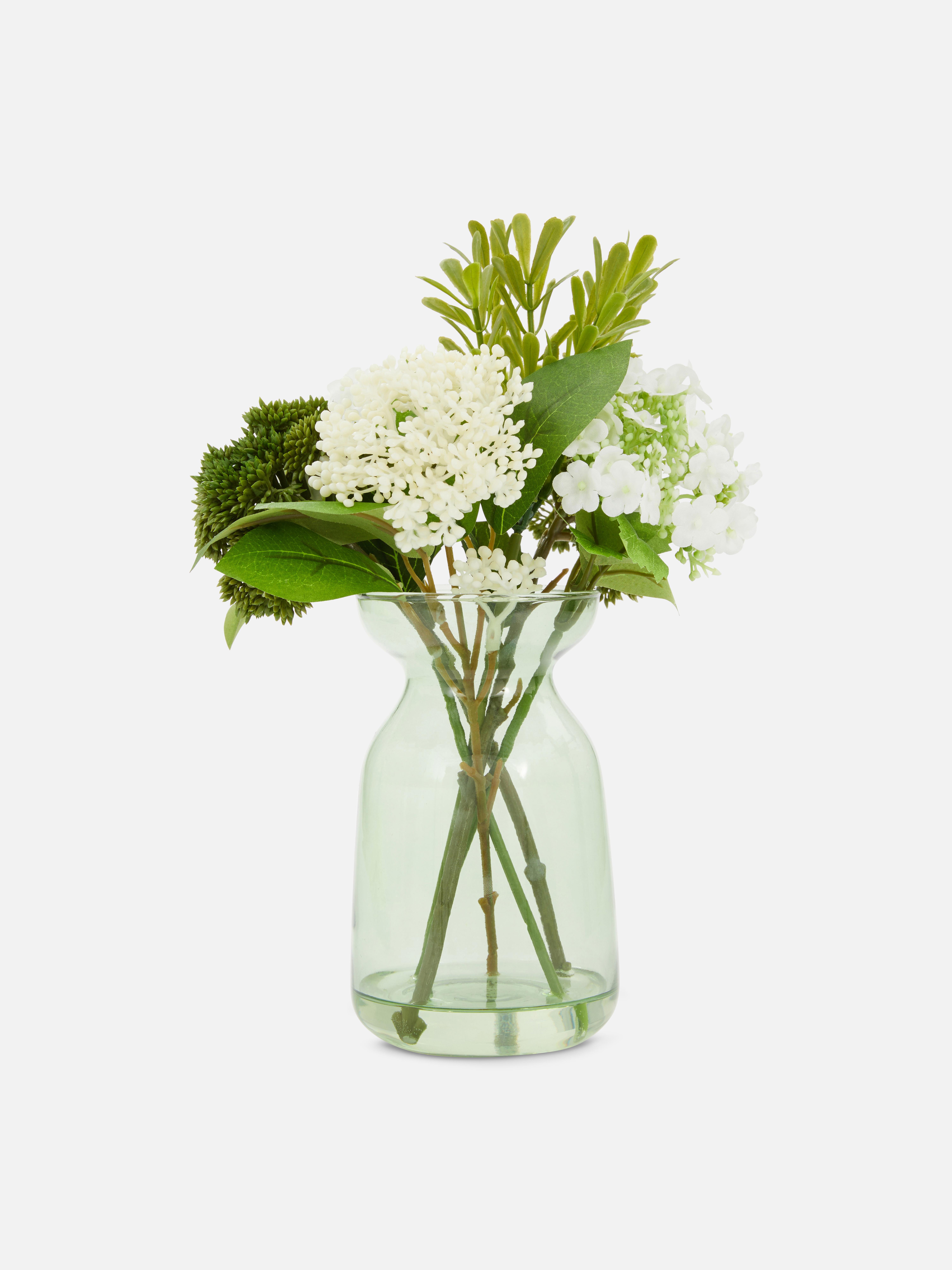 Composizione di fiori artificiali in vaso di vetro