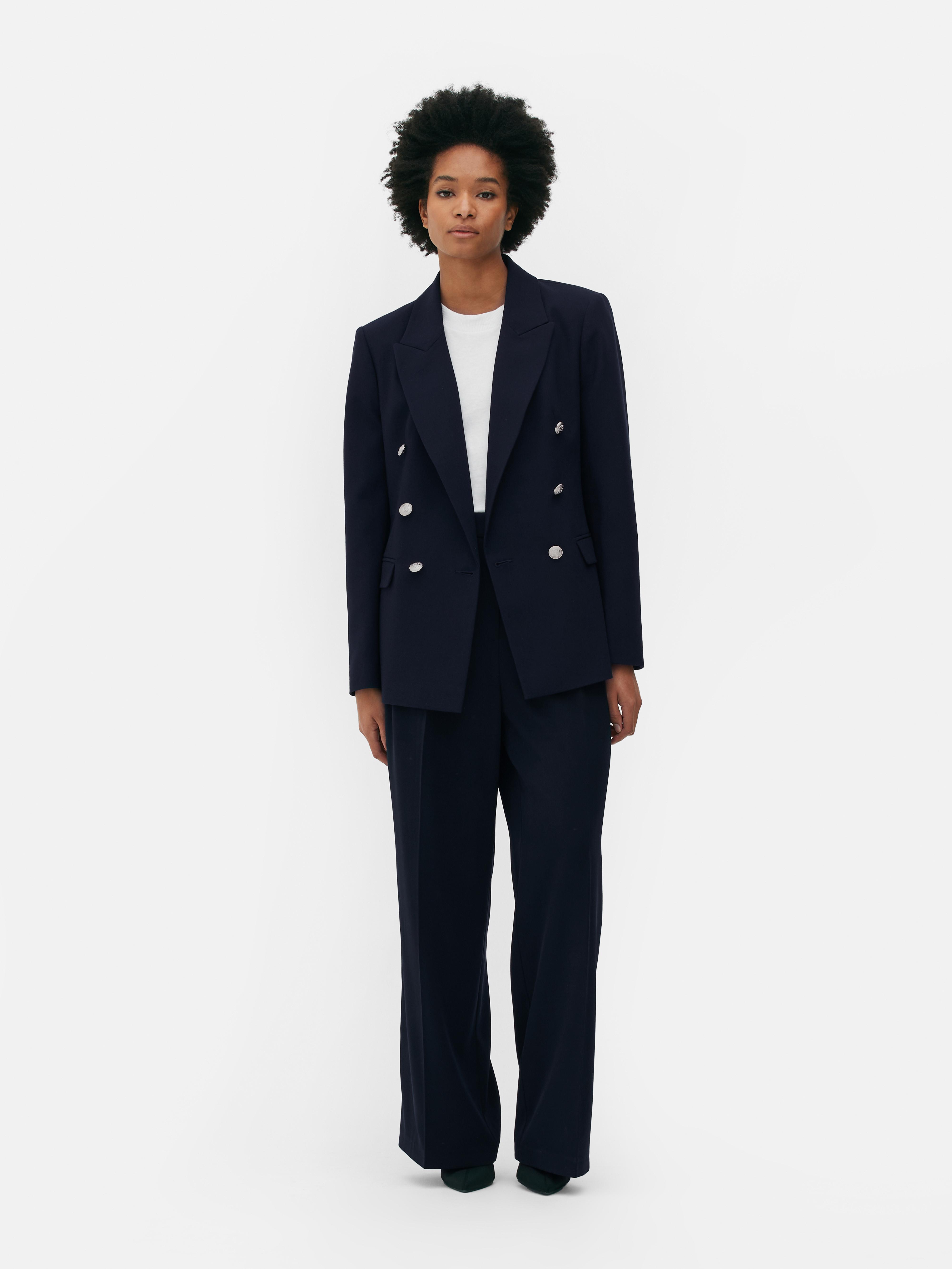 Blazer à boutonnage croisé avec bouton métallisé