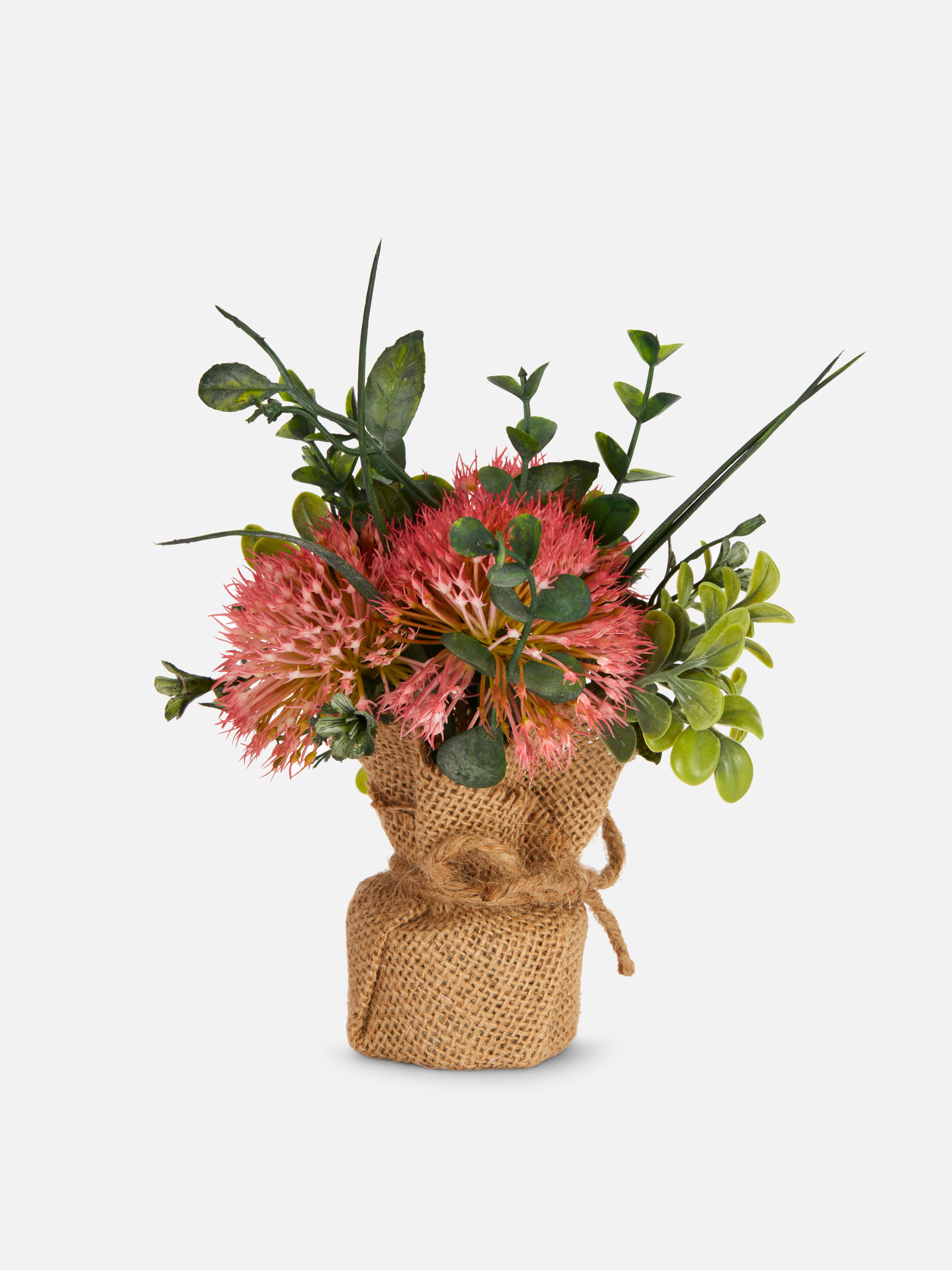 Composizione floreale artificiale con vaso in iuta