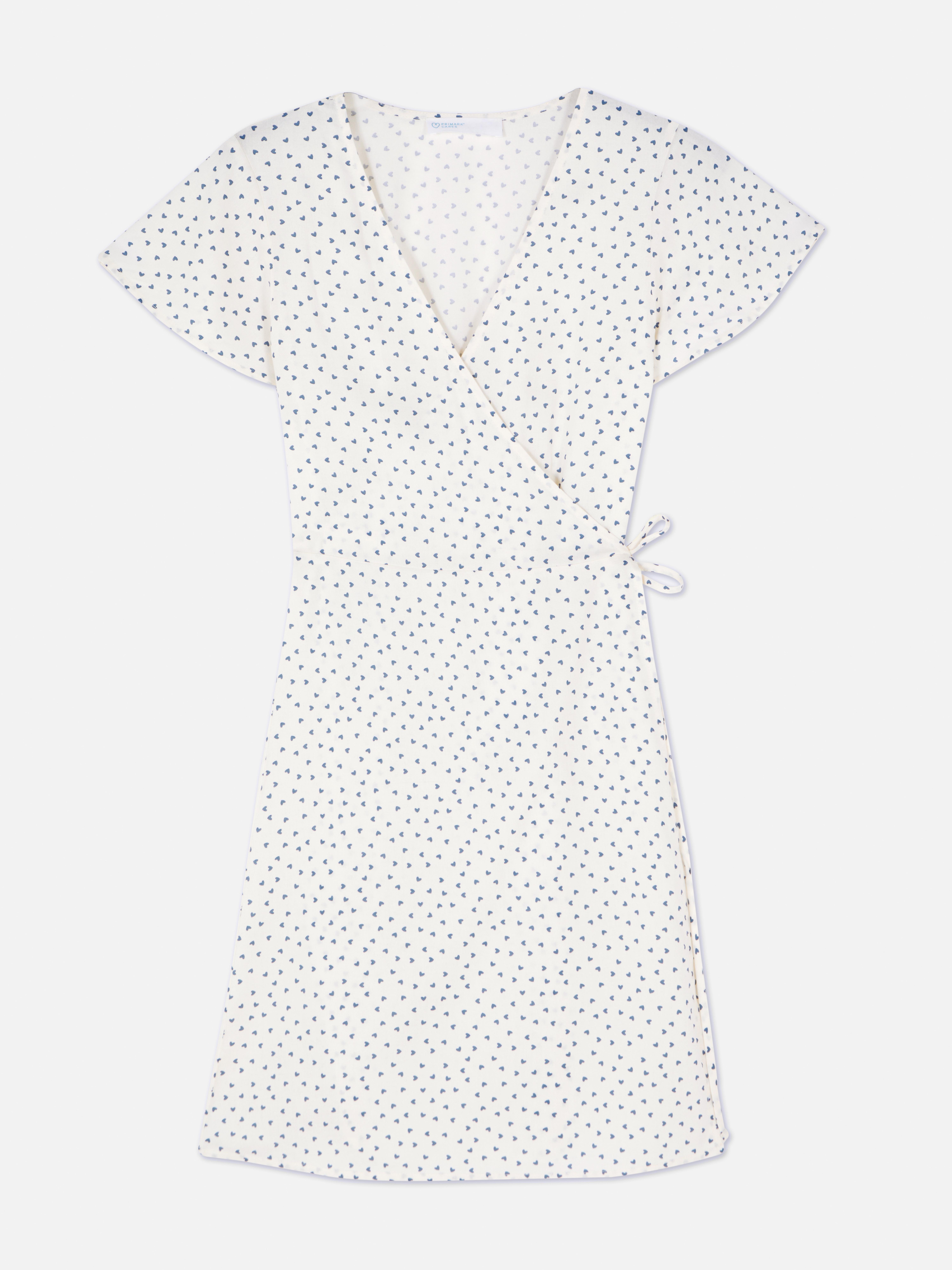 Vestido mini traçado manga capa