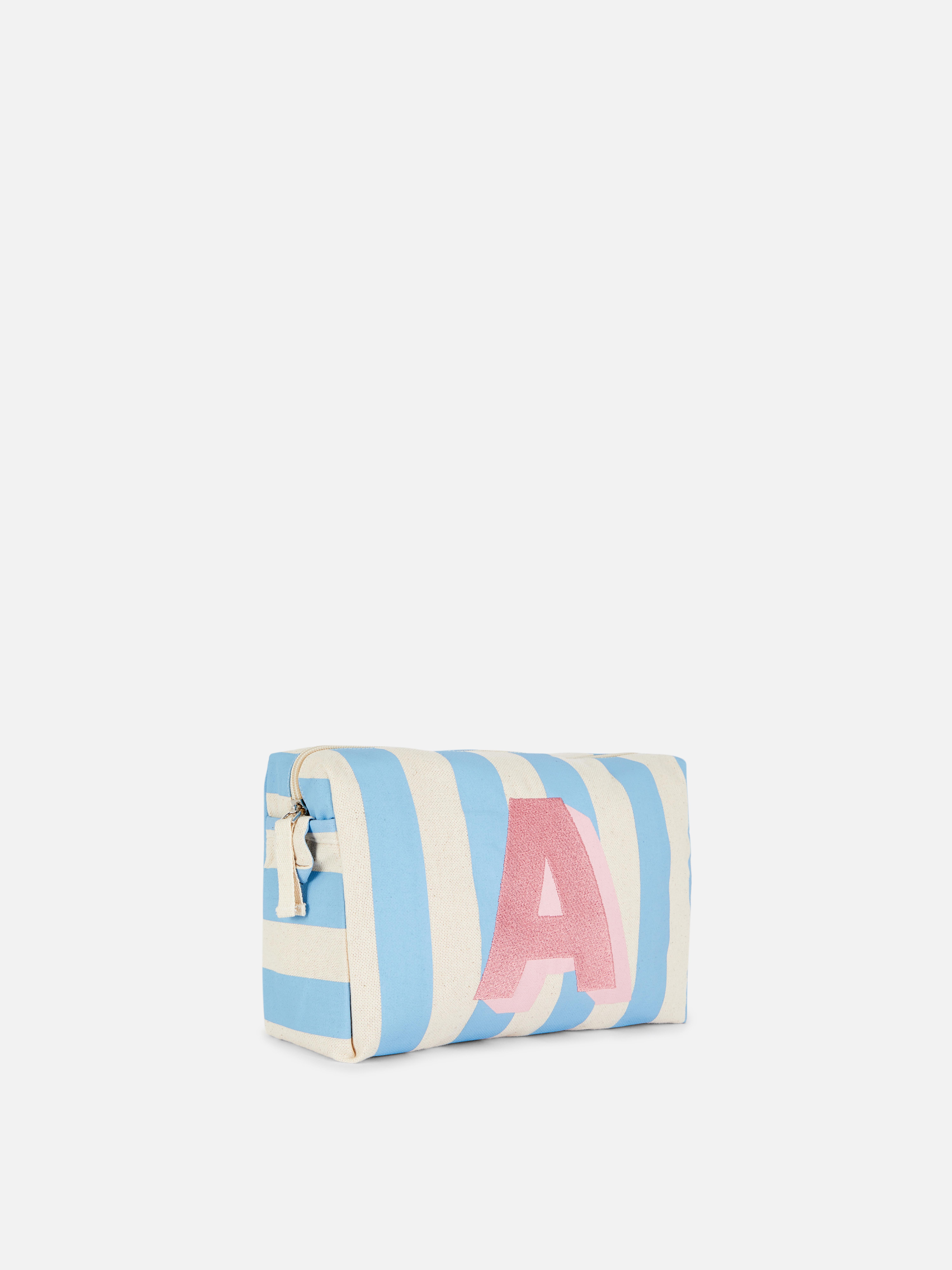 Geantă pentru cosmetice cu inițială și dungi